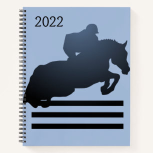 Carnet Afficher le cavalier franchissant un obstacle