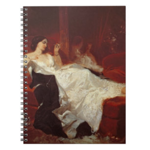 Carnet Femme sur un sofa rouge