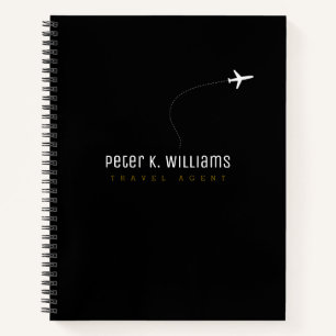 Carnet noir de l'agent de voyage avec avion