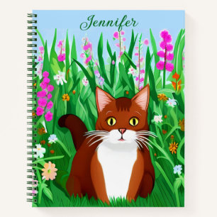 Carnet Petit gingembre Kitty Brown dans un champ de fleur