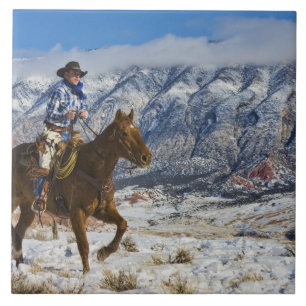 Carreau Cow-boy à cheval portant des chaps en cuir