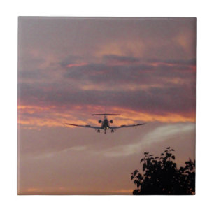 Carreau En Céramique Atterrissage d'un jet commercial au coucher du sol