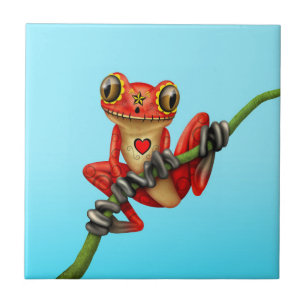 Carreau En Céramique Jour rouge de la grenouille d'arbre morte de crâne