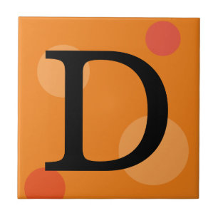 CARREAU EN CÉRAMIQUE MONOGRAMME ORANGE ET TITRES POIS