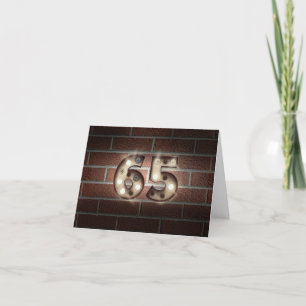 Carte 65e anniversaire-marquee lumières sur mur en briqu
