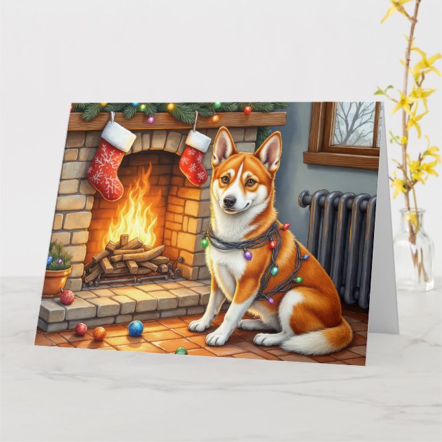 Carte Basenji assis près de la cheminée avec des lumière (Fleur jaune)