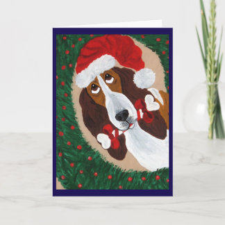 Carte Basset Hound Père Noël regardant à travers la Cour