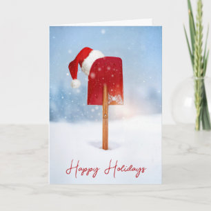 Carte Chapeau de Père Noël sur une pelle à neige rouge d
