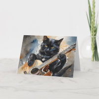 Chat noir star de rock jouant de la guitare acoust