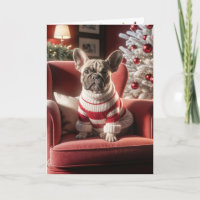 Chien de taureau français de Noël sur une chaise r