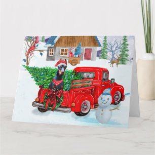 Carte Chien Doberman dans un camion de livraison de Noël