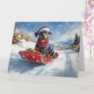 Carte Chien Doberman dans un traîneau Laissez neige Noël