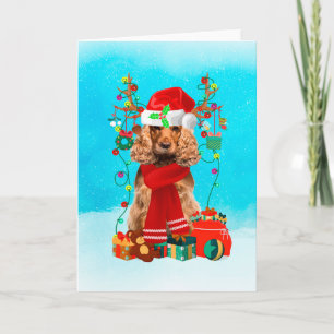 Carte Cocker Spaniel dans la neige avec cadeaux de Noël