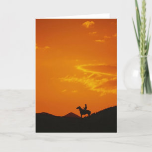 Carte Coucher de soleil orange avec silhouette Cowboy