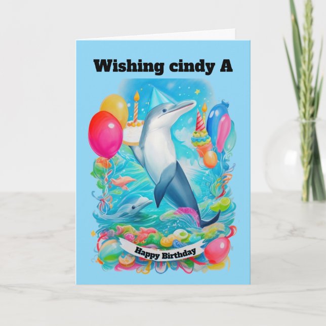 Carte Dauphin Portant un casquette d'anniversaire tenant (Devant)