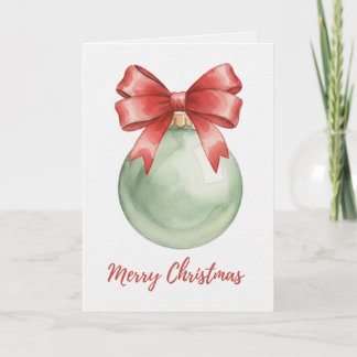 Carte de boule de Noël verte avec nœud rouge