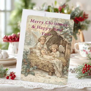 carte de Noël avec bébé Jésus dans une crèche 