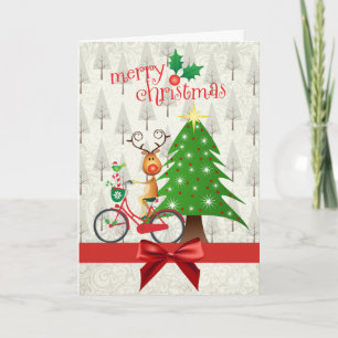 Carte de Noël avec le renne sur la bicyclette