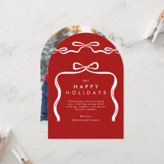 Carte de Noël avec ruban à nœuds rouges