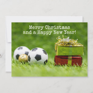 Carte de Noël de football avec boules et boîtes ca