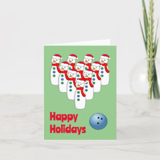 Carte de Noël pliée avec des bonhommes de neige au