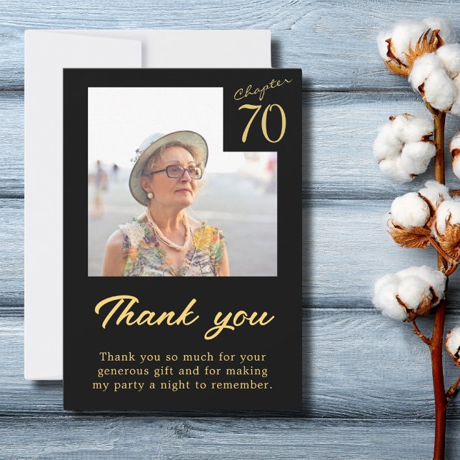 Carte De Remerciements 70e anniversaire Black Gold Turning 70 (70th birthday black and gold thank you card with photo on a blue wooden table top.)