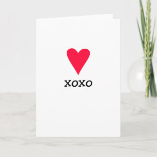Carte de voeux avec un coeur rouge et xoxo pour l'