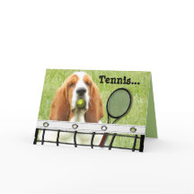 Carte de voeux de basset avec la raquette et la