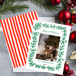 Carte de vœux de Noël avec un nœud vert dessiné à