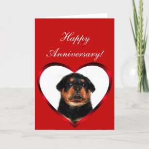 Carte de voeux heureuse de chiot de rottweiler