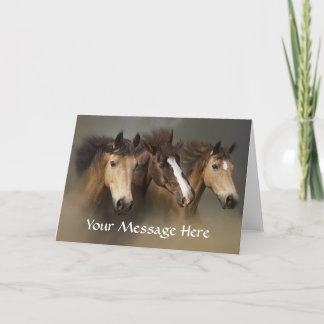 Carte de voeux sauvage de trio de chevaux