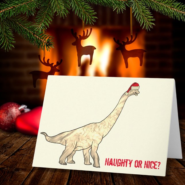 Carte Drôle Brachiosaurus Père Noël Dinosaur Citation de (Funny Christmas dinosaur wearing a Santa hat with naughty or nice quote)