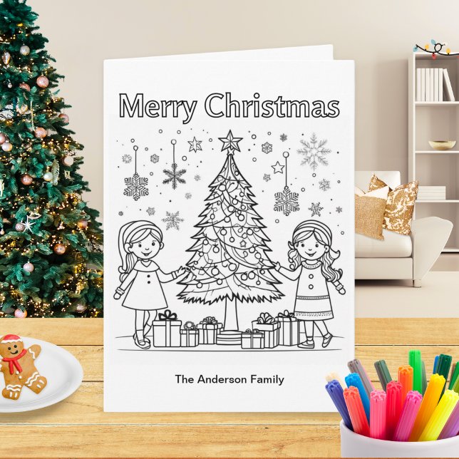 Carte Enfants Vacances Coloriage Arbre Joyeux Noël (A Christmas card for children to color in, with picture of two girls decorating a Christmas tree)