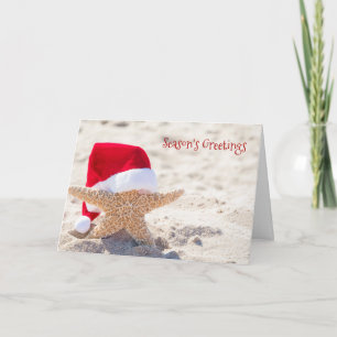 Carte étoile de mer de Noël dans le sable de la plage