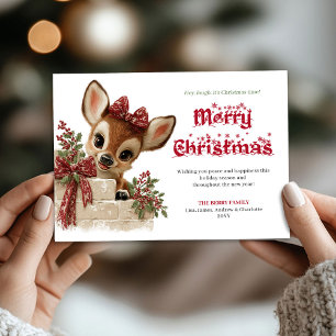 Carte festive de Noël avec un renne drôle qui rega