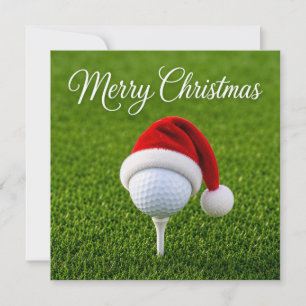 Carte Golf Noël avec un chapeau de Père Noël sur de l'he