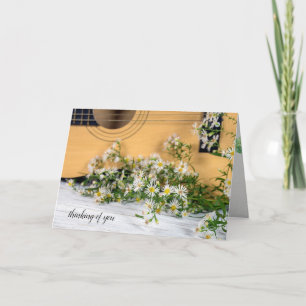 Carte guitare avec des fleurs sauvages