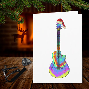 Carte Guitare de Noël portant un chapeau de Père Noël