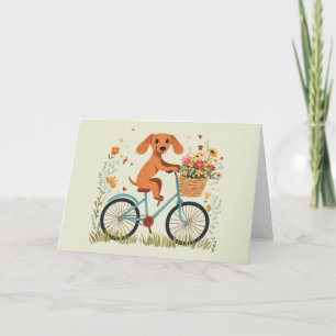 Carte Joli chien teckel à vélo Fleurs printanières
