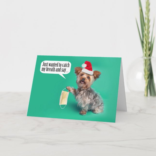 Carte Joyeux Noël Yorkie Chien tenant le masque du visag (Devant)