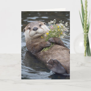 Carte Loutre flottant avec bouquet de fleurs sauvages