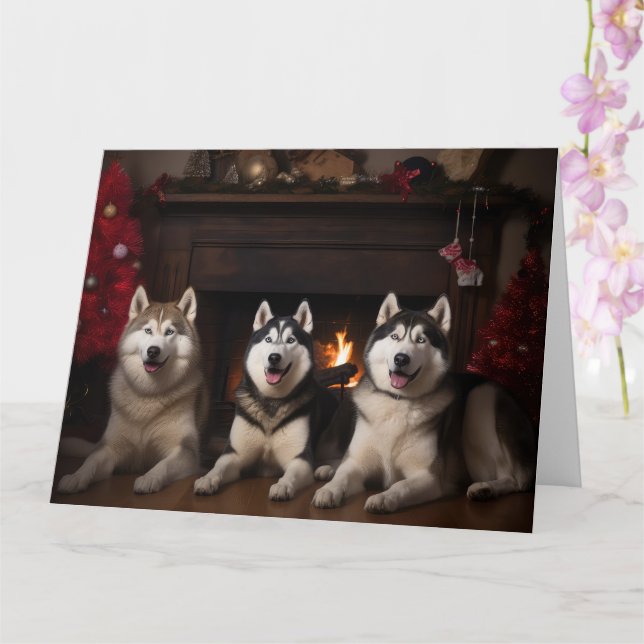 Carte Malamute en Alaska près de la cheminée Noël (Orchidée)