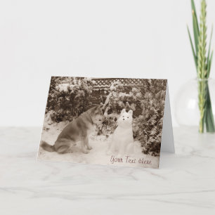 Carte mignonne akita assis avec un chien de neige noël