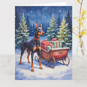 Carte Noble Doberman gardant le traîneau de Noël en hive