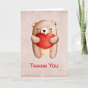 Carte Ours en peluche mignon portant un cœur rouge Merci