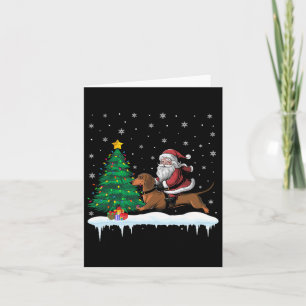 Carte Père Noël montant un chien teckel garçons filles e