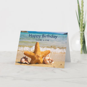 Carte Poisson étoilé et coquillages sur la plage Anniver