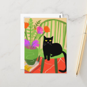Carte Postale Adorable Chat noir sur une chaise verte
