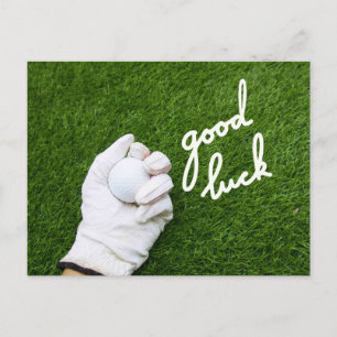 Carte Postale Balle de golf en main avec le mot GOOD LUCK sur fo