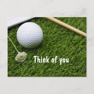 Carte Postale Boule de golf avec une petite fleur sur l'herbe pe